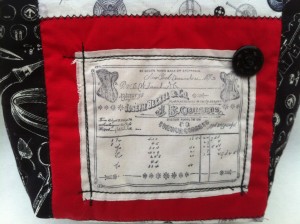 Black, white and red corset bag detail